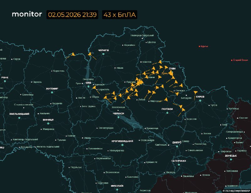 A dark-themed map of Ukraine displays numerous orange aircraft icons clustered over the central and northeastern regions, with Cyrillic city labels and a timestamp reading "02.05.2026 21:39."