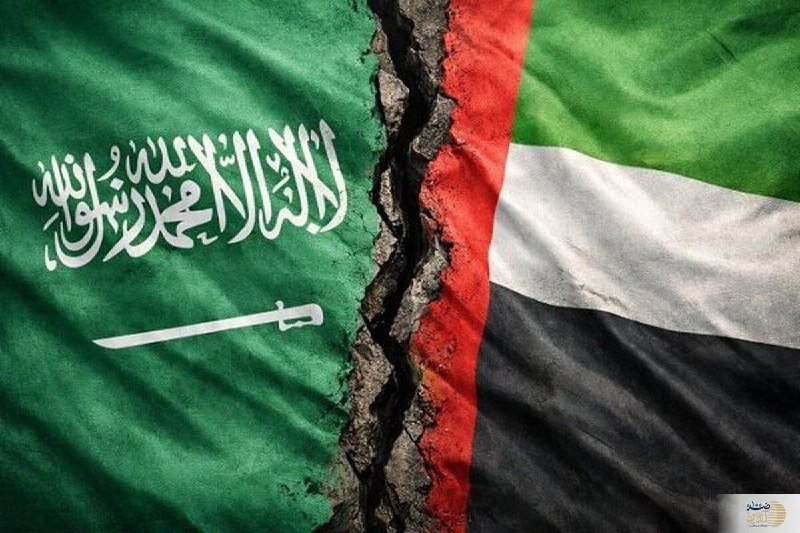 A digital graphic depicts the green flag of Saudi Arabia on the left, separated by a jagged crack from the United Arab Emirates flag on the right, symbolizing a rift or division between the two.