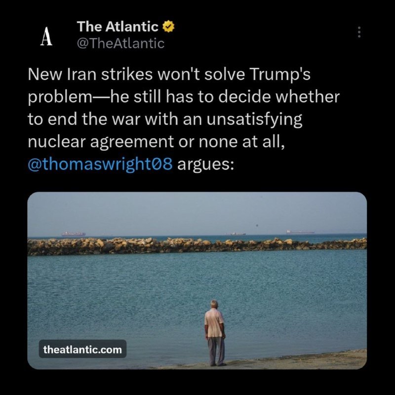 A screenshot of an X post by The Atlantic featuring a photo of a man standing at the edge of the sea looking toward distant ships.