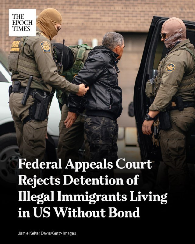 A news graphic with text "Federal Appeals Court Rejects Detention of Illegal Immigrants Living in US Without Bond" overlaid on a photo of masked, armed officers escorting a handcuffed man in a black jacket toward a vehicle.