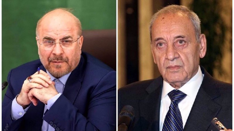 Side-by-side portraits of two men in dark suits; the left man wears glasses with hands clasped, the right man wears a striped tie, with a microphone visible below.