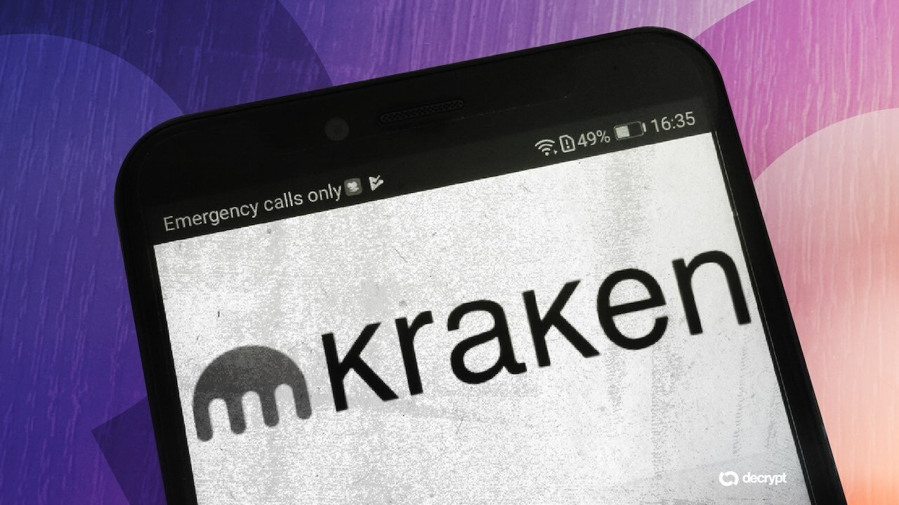 A smartphone displays the Kraken logo on its screen with an "Emergency calls only" notification, set against a purple and pink background with a "decrypt" watermark.