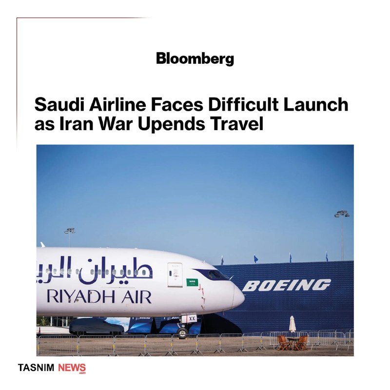 A split-screen news broadcast shows a man with glasses and an earpiece speaking on the right, alongside footage of a crowd holding flags and a rocket trail in the sky, with Arabic text and a live tag.