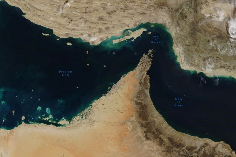 Satellite image showing the Persian Gulf, Strait of Hormuz, and Gulf of Oman with surrounding arid landmasses.