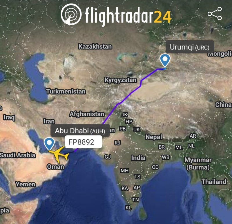 A Flightradar24 map graphic displays a purple flight path tracking plane FP8892 from Urumqi (URC), China, to Abu Dhabi (AUH), United Arab Emirates, across Central Asia.