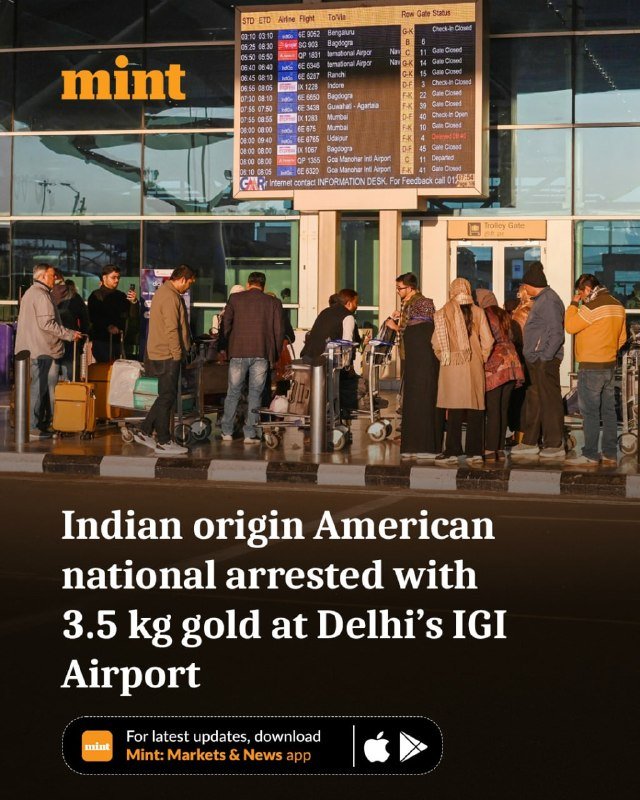 People with luggage stand near a Trolley Gate beneath an airport departure board showing flight statuses, alongside a Mint news graphic reading "Indian origin American national arrested with 3.5 kg gold at Delhi's IGI Airport."