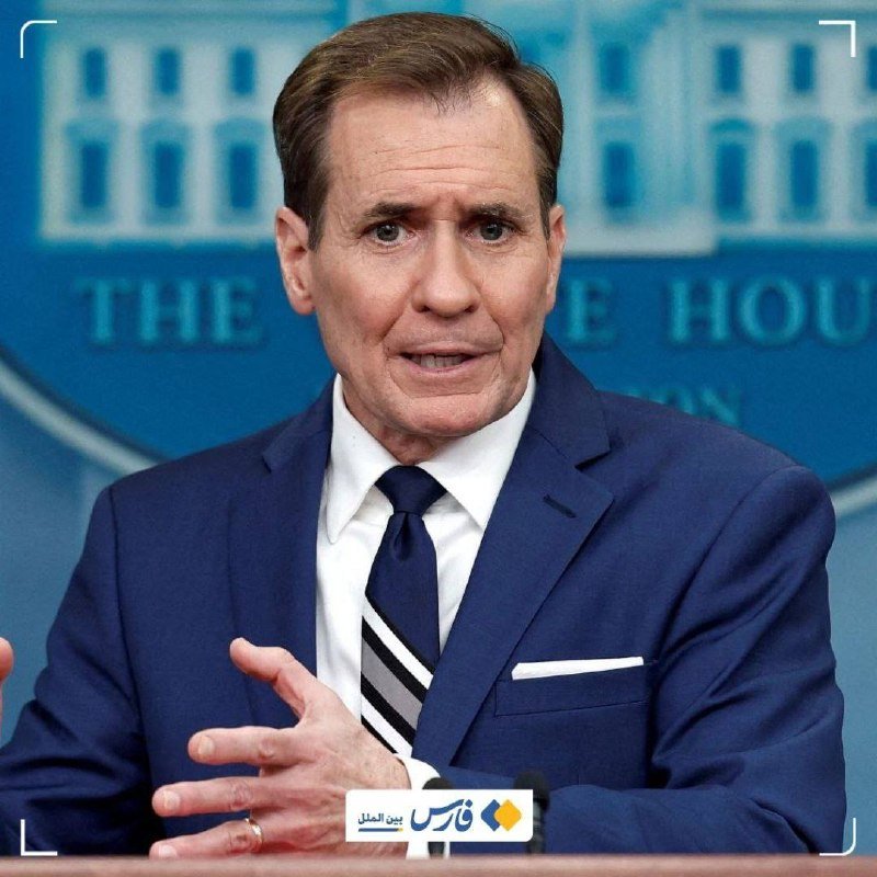 A man in a navy suit and striped tie gestures with his hand while speaking at a podium bearing the White House seal backdrop.