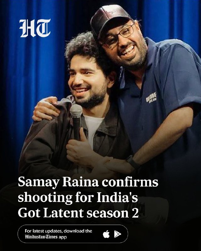 Two smiling men embrace on a blue-curtained stage, one holding a microphone, beneath an "HT" logo and a headline about "Samay Raina."