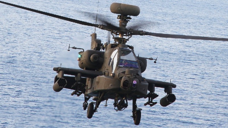 Hours after telling reporters a deal with Tehran was two or three days away, the US president said Iran had shot down an American helicopter over the strait.