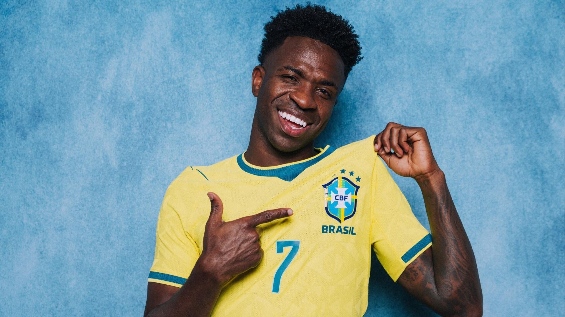 The FIFA World Cup Original Trophy sits on a black pedestal labeled "FIFA WORLD CUP ORIGINAL TROPHY" outside a large stadium displaying a "FIFA WORLD CUP 2026 THE FINAL" banner.