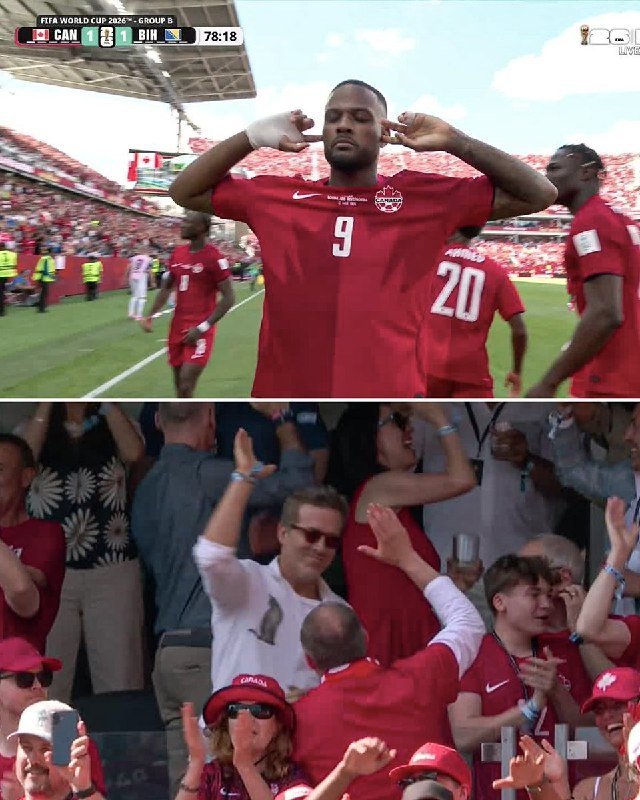 A Canadian soccer player wearing jersey number 9 covers his ears with both hands in a stadium, while fans in the stands below clap and cheer.