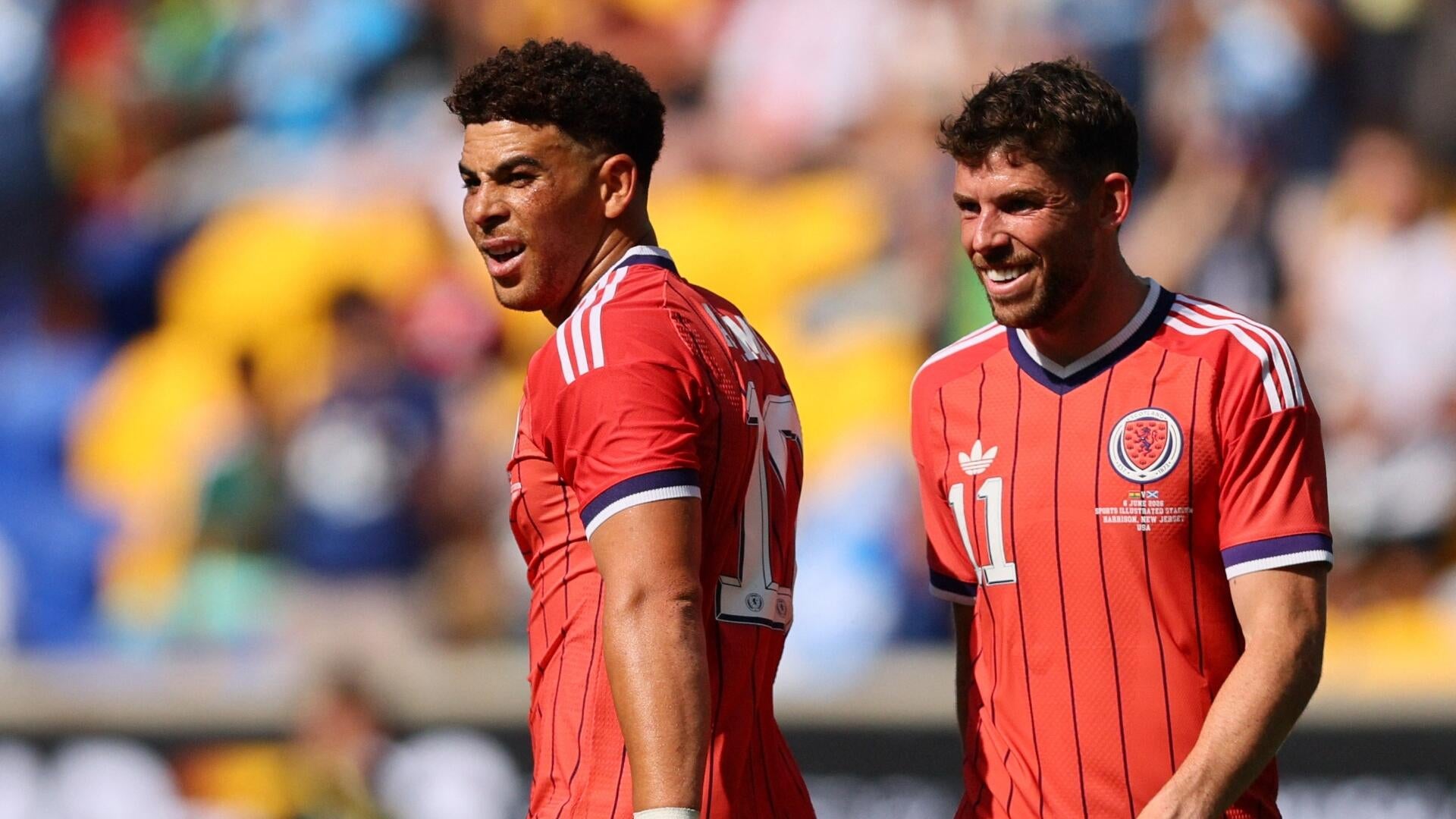 A graphic displays 48 national flags labeled as qualified nations for the FIFA World Cup 2026, with Turkey and Haiti marked as eliminated alongside two soccer players.