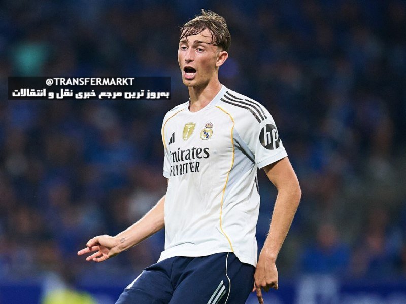 A young soccer player in a white Real Madrid jersey with "Emirates Fly Better" and "hp" sponsorships runs on the field, with a Transfermarkt text overlay in Persian and English.