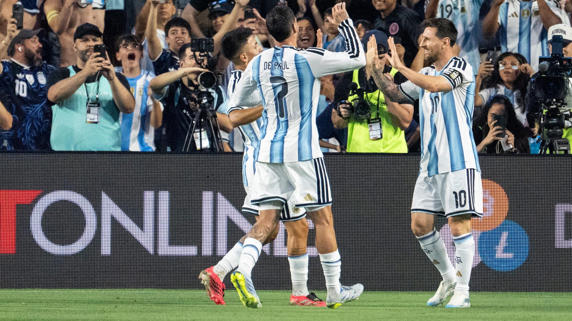 A three-panel infographic displays soccer players in national uniforms with World Cup trophies, labeled "Winners 1934 & 1938 Italy," "1958 & 1962 Brazil," and "2022 & 2026 Argentina."