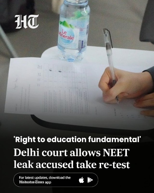 A hand writes on a printed answer sheet on a desk beside a bottle of Le Minerale water, with an HT news headline about a Delhi court allowing a NEET leak accused to retake the test.