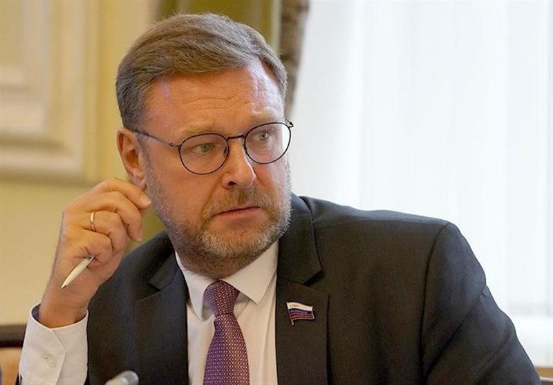 A PRESSTV broadcast graphic features a man with glasses and a mustache labeled "Dmitry Trenin, President, Russian International Affairs Council," alongside two smaller circular portraits of other men, with flags in the background.