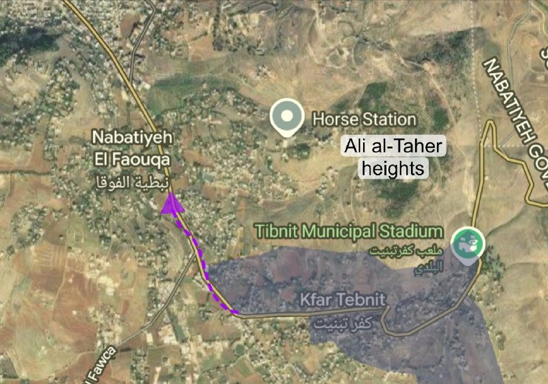 Satellite map graphic showing labeled locations including Nabatiyeh El Faouqa, Horse Station, Ali al-Taher heights, Tibnit Municipal Stadium, and Kfar Tebnit, with a purple arrow marking a route.