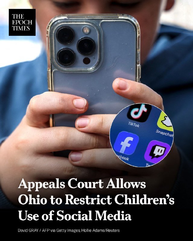 A person in a blue shirt holds a smartphone displaying app icons for TikTok, Snapchat, Facebook, and Twitch, with overlaid text about an appeals court ruling on Ohio restricting children's social media use.