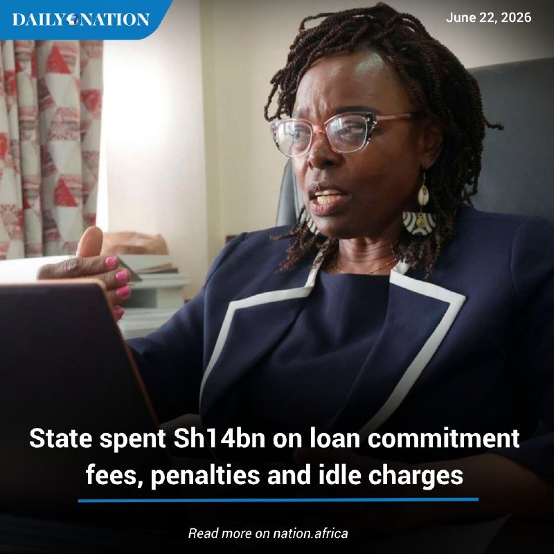 A woman with braided hair and glasses speaks while seated in an office, gesturing with her hand beside a laptop, as an overlaid headline reads "State spent Sh14bn on loan commitment fees, penalties and idle charges."