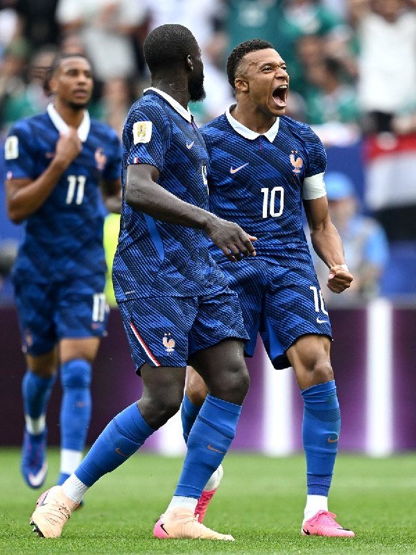 Graphic highlights three soccer players—labeled Lionel Messi, Kylian Mbappé, and Erling Haaland—each paired with the word "BRACE" and an opposing team: Austria, Iraq, and Senegal.