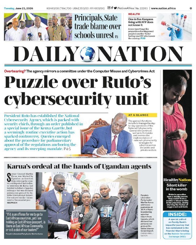 A man in a blue suit signs a document at a desk, with flags behind him, under a "Daily Nation" headline reading "Puzzle over Ruto cybersecurity unit."