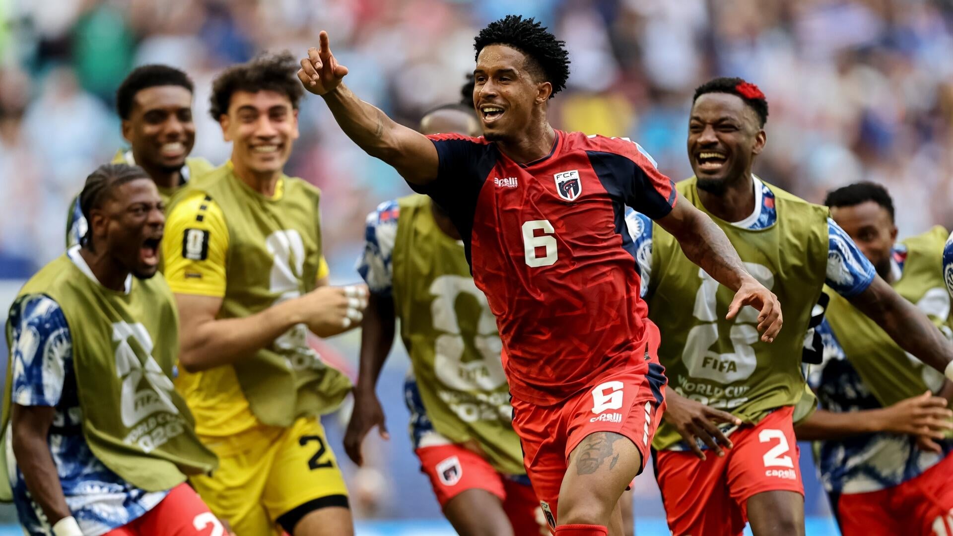 A graphic shows a soccer player in a black Canada jersey shouting in celebration, with a final score overlay reading "South Africa 0-1 Canada" and "S. Eustaquio 90+2'."