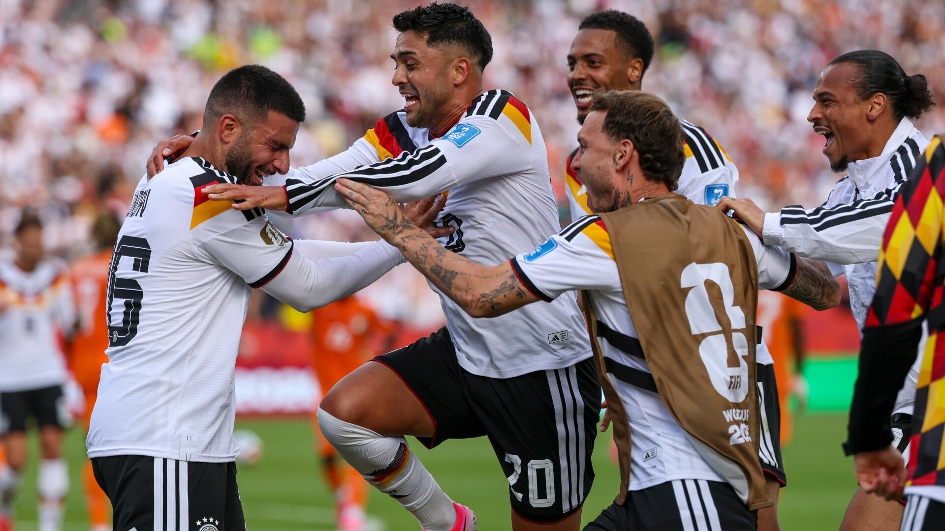 A tearful soccer player with bleached blonde hair embraces a teammate, accompanied by a graphic titled "Germany's World Cup Penalty Shootout Record" listing matches from 1982 to 2026 with an overall record of 4 wins and 1 loss.