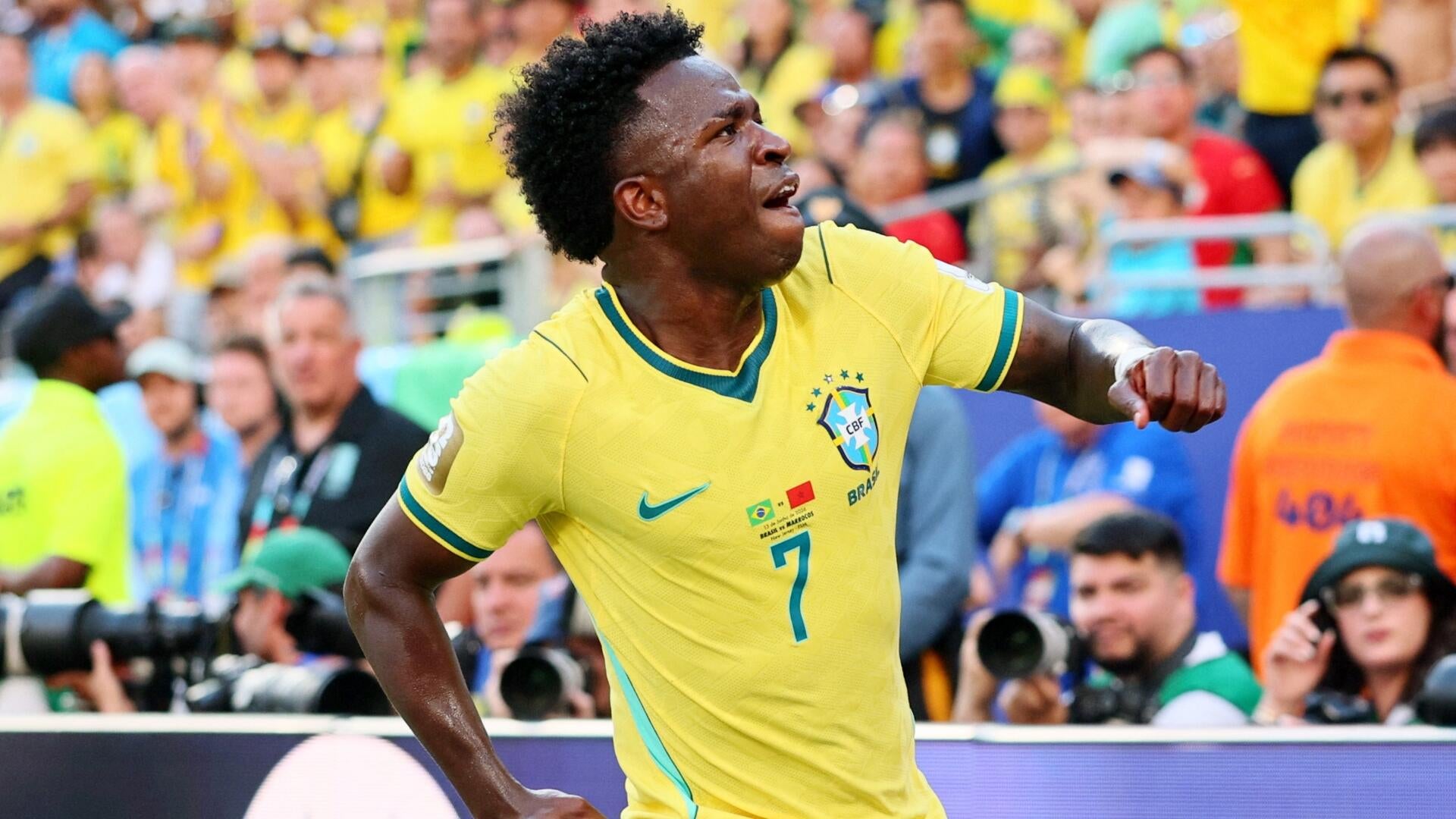 Illustrated promotional poster showing two soccer players in profile facing each other, labeled "Japan" and "Brazil," advertising a "Round of 32" FIFA World Cup 2026 match on June 25, 2026, at Houston Stadium.