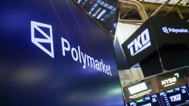 Illuminated "Polymarket" and "TKO" signs are displayed on digital screens inside the New York Stock Exchange trading floor.