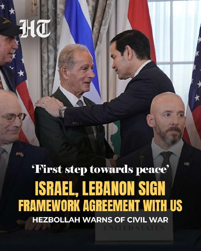 A news graphic showing four men in suits near US and Israeli flags, with overlay text: "'First step towards peace' ISRAEL, LEBANON SIGN FRAMEWORK AGREEMENT WITH US — HEZBOLLAH WARNS OF CIVIL WAR."
