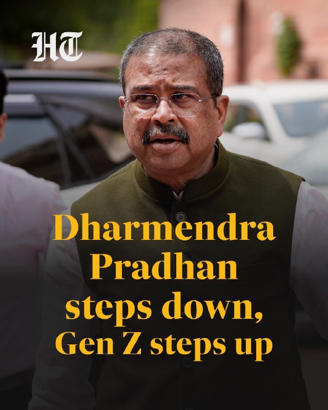 The image is a graphic featuring a man with glasses and a mustache wearing a dark vest, overlaid with the text "Dharmendra Pradhan steps down, Gen Z steps up."