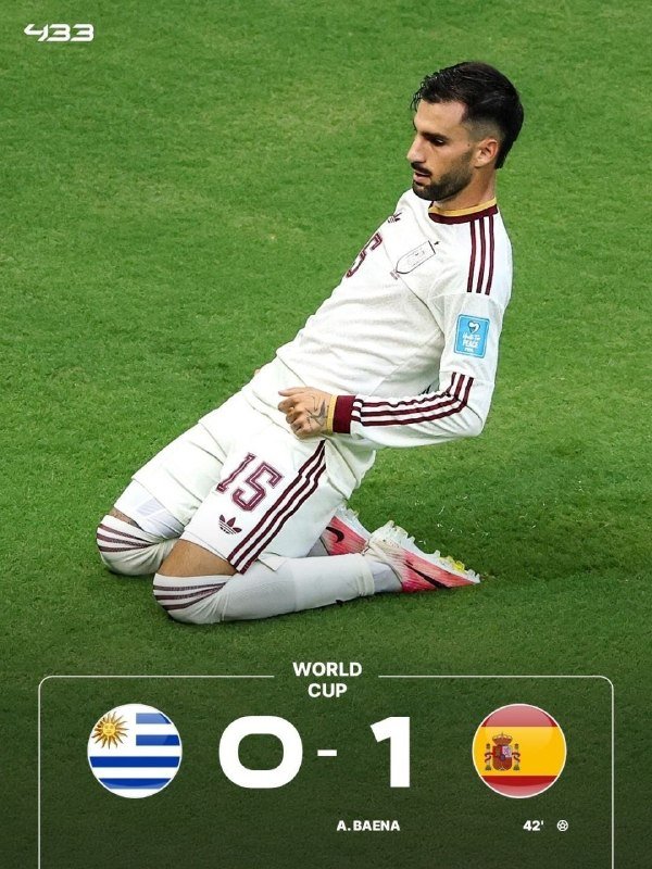 Three soccer players in dark jerseys celebrate exuberantly on the field while opposing players in white and red jerseys walk away dejectedly.
