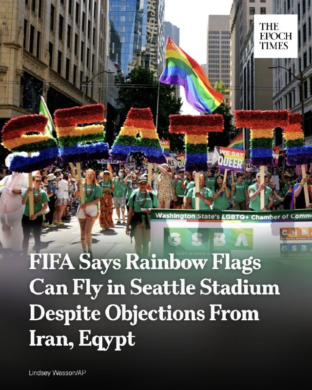 Parade participants march down a city street carrying large rainbow-colored "SEATTLE" letters and a rainbow flag, with The Epoch Times logo and a FIFA headline overlaid.