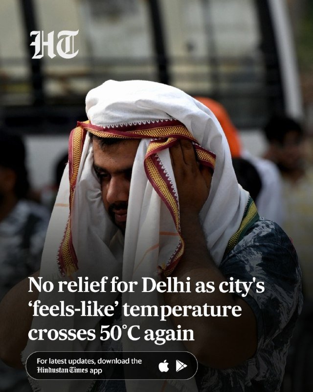 A man adjusts a white cloth over his head as a covering against the heat, with a news headline reading "No relief for Delhi as city's 'feels-like' temperature crosses 50°C again."