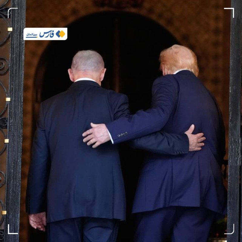 Two men in dark suits walk through an open doorway with their arms around each other's backs, viewed from behind.
