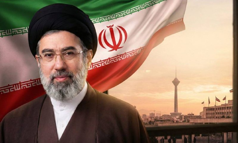 A composite graphic features a bearded man wearing a black turban and glasses, with an Iranian flag and the Tehran skyline visible behind him.