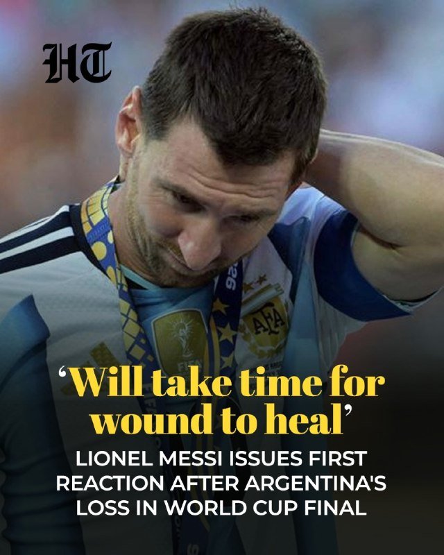 A close-up photograph shows a man in a blue and white striped jersey with a medal around his neck, looking downward with his hand behind his head.
