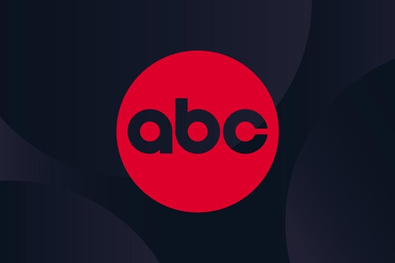 A red circle containing the lowercase letters "abc" appears against a dark background with subtle curved shapes.