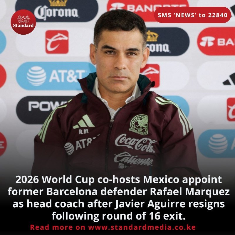A man in a maroon Mexican Football Federation jacket sits in front of a sponsor backdrop featuring Corona, AT&T, and Banorte logos.