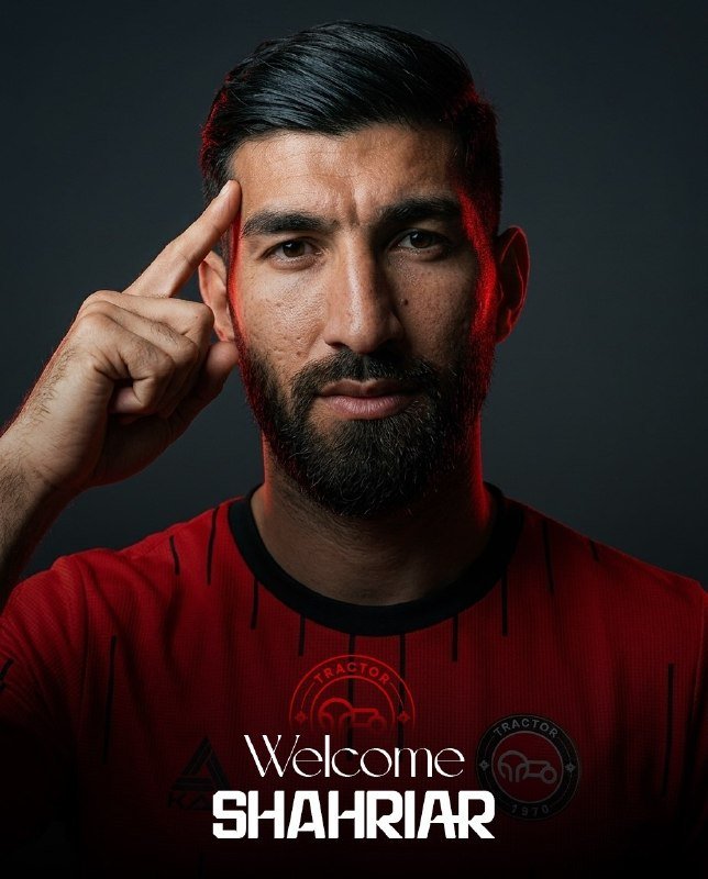 A bearded man in a red jersey points to his temple, with on-screen text reading "Welcome SHAHRIAR" and a "TRACTOR" club logo.