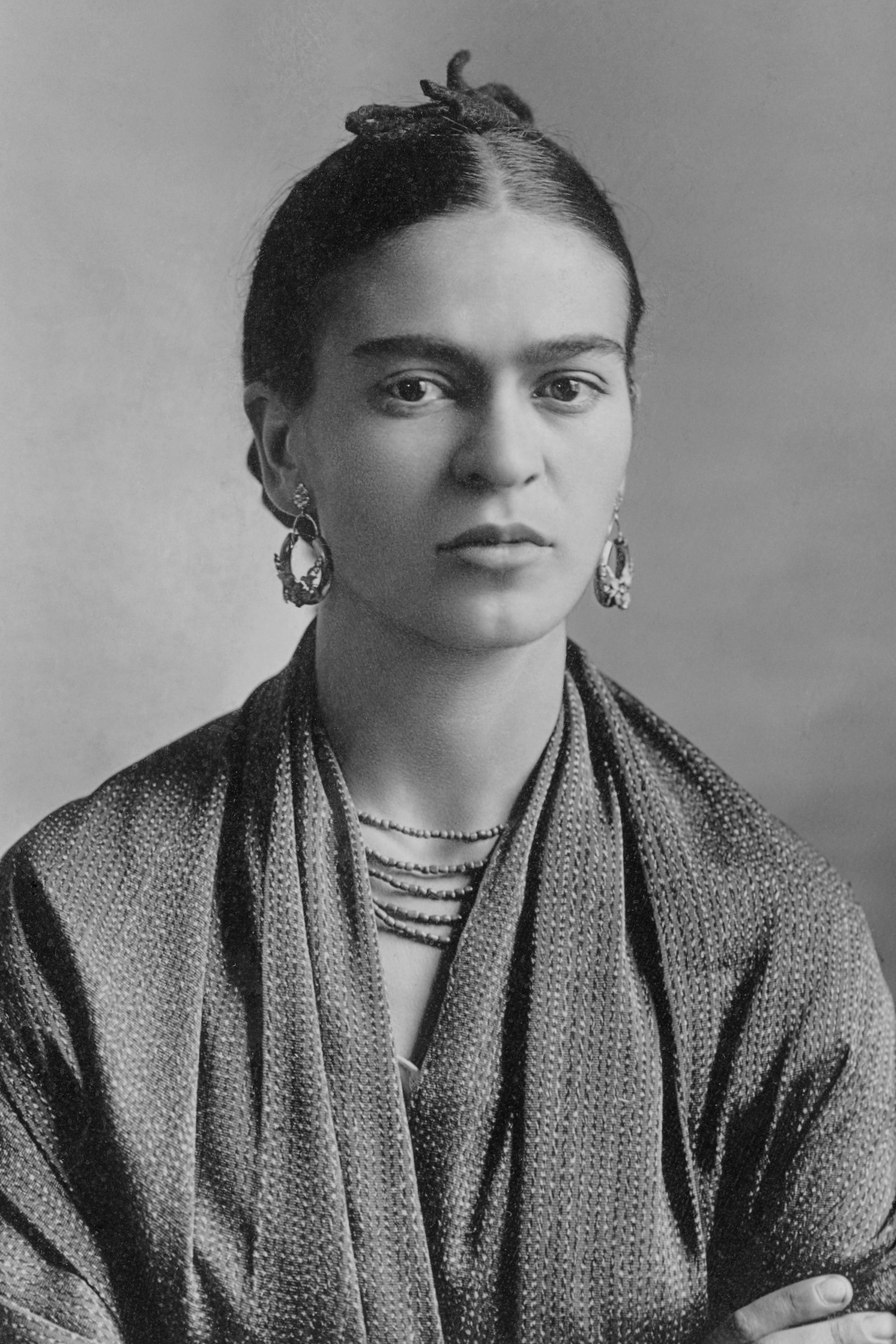 More than seven decades after her death, Frida Kahlo remains one of the most reproduced and re-marketed artists in the world — a durability that says less about her paintings than about the persona she built around them.