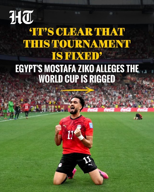 A footballer in a red Egypt jersey kneels on a pitch, arms flexed and fists clenched, with stadium crowds and overlaid headlines visible behind him.