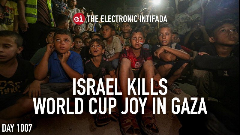 A news caption overlays an image of children sitting closely together, appearing to watch something off-camera, with text reading "ISRAEL KILLS WORLD CUP JOY IN GAZA, DAY 1007."