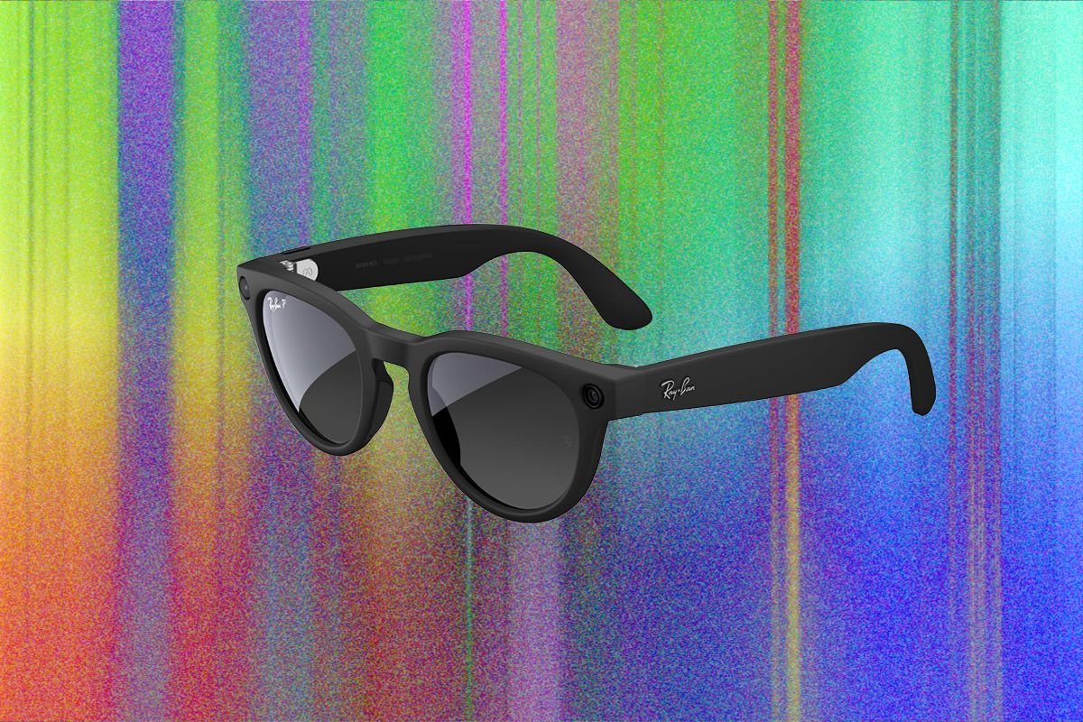 A pair of black Ray-Ban smart glasses with dark lenses and a small side-mounted camera is displayed against a colorful, vertically striped digital background.