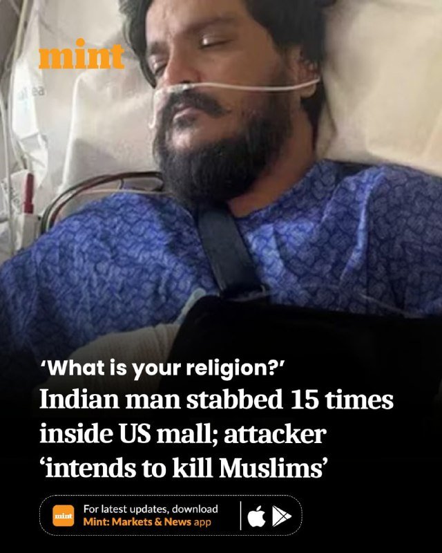 A bearded man lies in a hospital bed wearing a nasal cannula, with a headline reporting he was stabbed 15 times inside a US mall.
