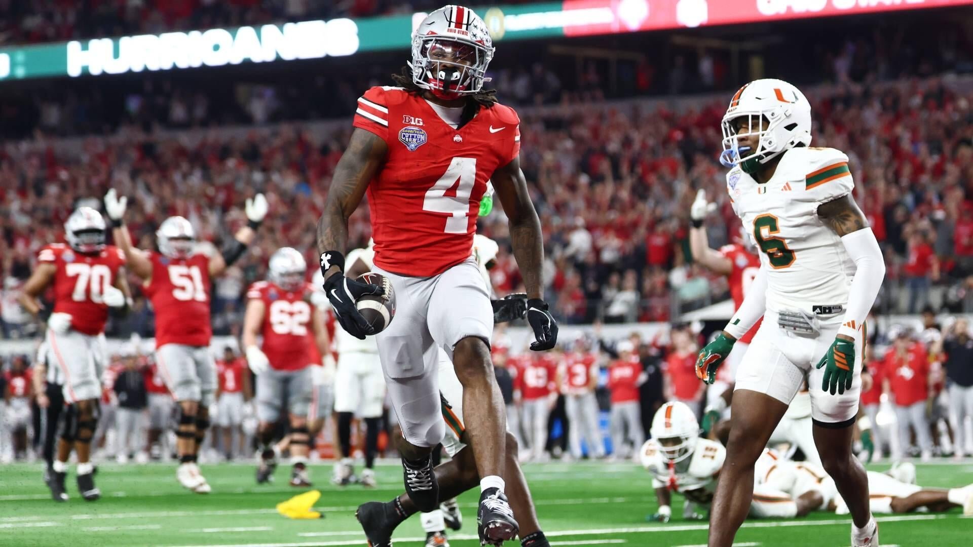 Ohio State player #4 in a red jersey runs with the football while a Miami player in a white #6 jersey walks nearby on the field.