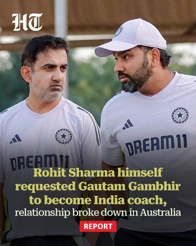 Two men wearing matching white "DREAM11" athletic shirts stand together outdoors, one in a white cap, with overlaid news-style text below them.