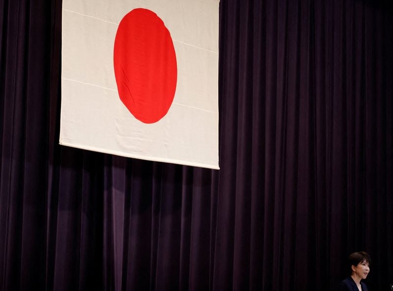 Sanae Takaichi is on the record defending a 370 trillion yen ($2.3 trillion) growth drive against Nikkei Asia's reporting of "mounting market concerns," but the deflation framing at the heart of her case so far lives in an X repost, not a f…