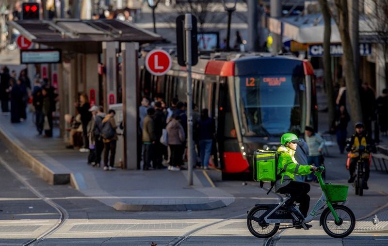 A delivery rider in an Australian capital city, in a file image circulated alongside reporting on the new minimum-pay framework.