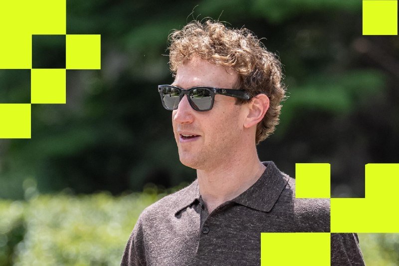 A man with curly hair wearing black sunglasses and a brown polo shirt stands outdoors, with bright yellow-green pixelated blocks visible in the foreground.